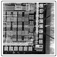 Figure 5. shows a photograph of the lower right part of the 1.9 x 1.8 mm2 large chip containing the LNA. In Fig. 6 the chip can be seen as mounted on the substrate and bonded to the printed input and output matching inductors. 